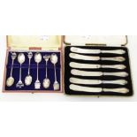 A boxed set of six silver handled butter knives - sold with a cased set of six marked 'Indian