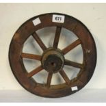 A small iron bound stained wood barrow wheel
