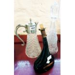 A glass decanter - sold with a claret jug with silver plated top and a vintage French cognac bottle