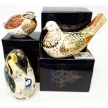 Three boxed Royal Crown Derby paperweights comprising Penguin, Dappled Quail and Turtle Dove, all