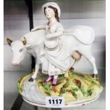 A Staffordshire figure of a milkmaid with a cow