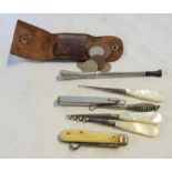 A collection of mother-of-pearl handled items including corkscrew, button hook, etc. - sold with a