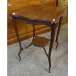 A 19 1/2" Edwardian mahogany two tier occasional table with moulded surfaces, set on slender