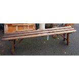 A pine trestle bench