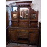 A 5' Edwardian walnut sideboard with triple bevelled mirror set raised back, turned supports and