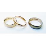 Two .375 gold wedding bands, one being re-struck - sold with an unmarked similar