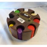 A wooden poker chip carousel with contents - a/f