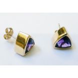 A pair of marked 14k yellow metal triangular stud ear-rings, each set with large amethyst to centre