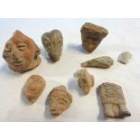 A small collection of Mayan pottery heads