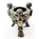 A small bronze pot set on three winged caryatids