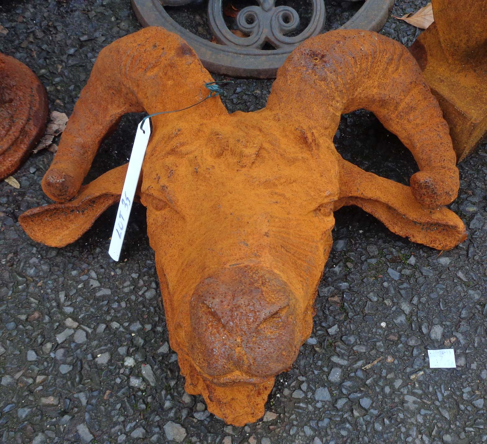 A cast iron ram's head with rust finish