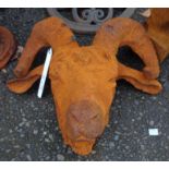 A cast iron ram's head with rust finish