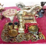 A quantity of brassware including trivets, pair of horse doorstops, horse brasses, etc.