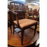 A 19th Century mahogany framed elbow chair with upholstered seat, set on moulded square tapered
