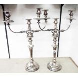 A pair of 21 1/2" silver plated three branch candelabra with detachable top sections and gadrooned
