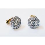A pair of marked 750 yellow metal diamond cluster stud ear-rings