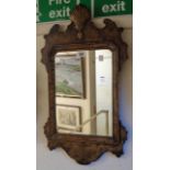 A Georgian style walnut framed wall mirror with shell pediment and float glass plate
