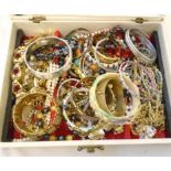 A vintage jewellery case containing a quantity of assorted costume jewellery