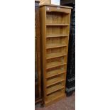 An 18" modern waxed pine nine shelf open bookcase
