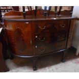 A 5' Edwardian flame mahogany veneered bow front sideboard with low raised back, three central