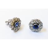 A pair of marked 750 white metal circular ear-rings, each with central collar set sapphire within