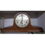 A stained oak cased Napoleon hat mantel clock with eight day Westminster chiming movement