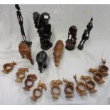A small collection of African carved wood tribal figures of people and animals