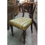 An early Victorian mahogany dining chair with overstuffed upholstery, set on moulded turned and