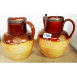 A pair of Doulton Lambeth harvest jugs - both cracked