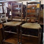 A pair of stained beech framed ladder back standard chairs with woven rush seat panels - one missing