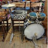 A 1960's drum kit comprising bass and snare with checkerboard finish, tom-toms with grey pearlised