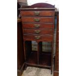 A 20 1/4" early 20th Century stained walnut music chest with five Stone's Patent drawers to top