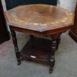 A 29 1/4" Edwardian inlaid walnut octagonal topped centre table with turned supports and undertier -