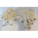 A pair of large resin polar bears
