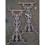 A pair of cast iron table supports