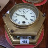 An early 20th Century cast brass and bevelled glass cased hexagonal desk timepiece with platform