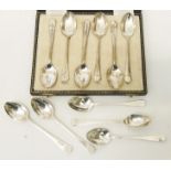 A case containing a set of six silver rat tail coffee spoons - Sheffield 1926 - sold with five