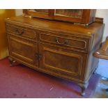 A 4' continental stained walnut bow front sideboard with two drawers over double cupboard, set on