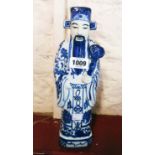 A Chinese blue and white figure of an Immortal - impressed mark to base