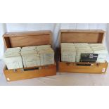 Two cases containing approximately two hundred mid-late 20th Century Ministry of Defence OS maps