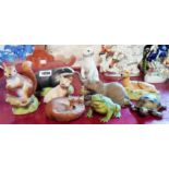 A collection of nine Aynsley bisque ceramic animals including elephant, tortoise, frog and bear,