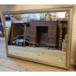 A modern parcel gilt framed and antiqued oblong wall mirror