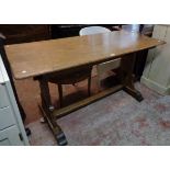 A 5' oak refectory dining table, set on heart pieced standard ends and pegged stretcher