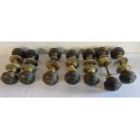 A quantity of turned rosewood doorknobs with brass plates