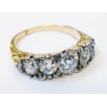 An antique yellow metal ring, set with old cut and rose diamonds - the central stone a replacement