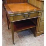 A 22" reproduction mahogany side table with leather inset top, frieze drawer and undertier, set on