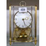 A vintage Kundo brass and glazed cased anniversary clock