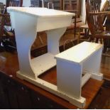 A vintage painted wood school desk with lift-top and integral seat