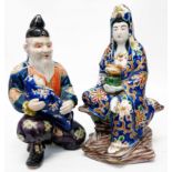 A pair of Chinese figures of an old man holding a baby and a woman holding a censer bowl (a/f)