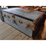 A vintage metal clad travelling trunk